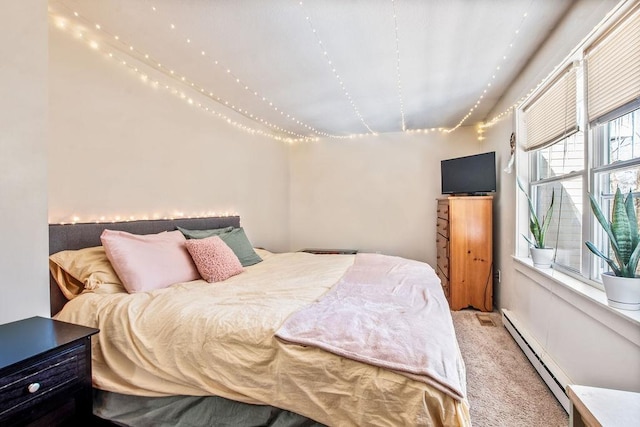 carpeted bedroom with a baseboard radiator