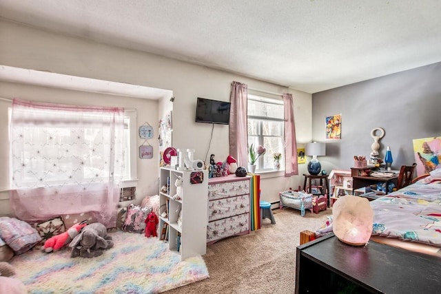 bedroom featuring carpet floors and baseboard heating