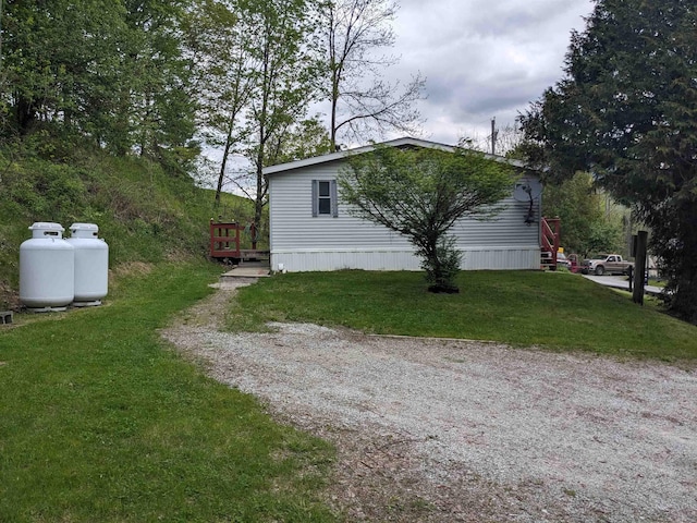 238/266 S Main St, Danby, VT 05739 - view of side of property with a lawn and a wooden deck