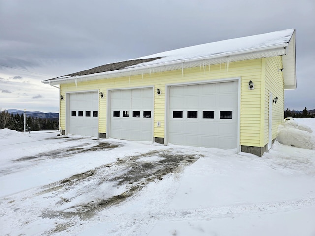 view of snow covered garage