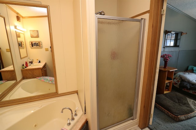 566 Baptist St, Williamstown, VT 05679 - full bathroom featuring a stall shower, connected bathroom, vanity, a textured ceiling, and a whirlpool tub