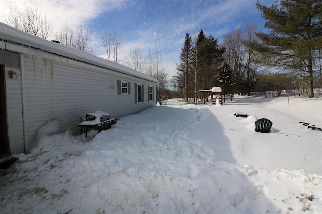 566 Baptist St, Williamstown, VT 05679 - yard covered in snow featuring a garage