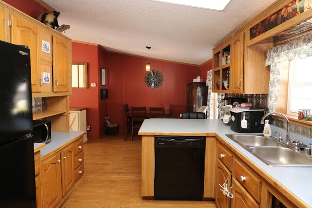 566 Baptist St, Williamstown, VT 05679 - kitchen with open shelves, a peninsula, a sink, light countertops, and black appliances