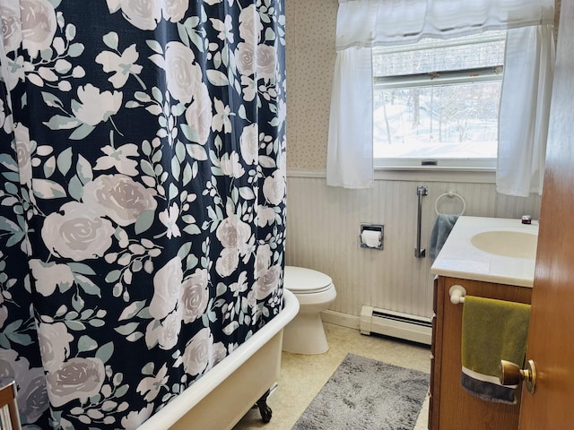 bathroom with a baseboard radiator, toilet, a wainscoted wall, vanity, and wallpapered walls