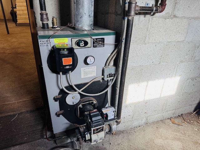 utility room featuring a heating unit