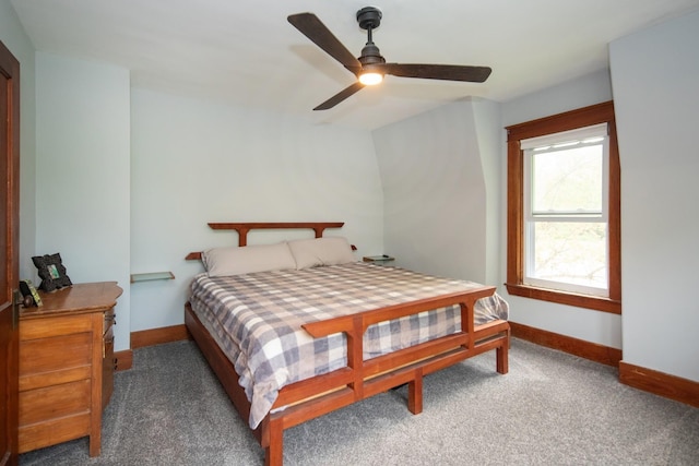 carpeted bedroom featuring baseboards and ceiling fan