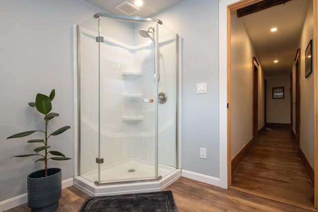 full bathroom featuring visible vents, baseboards, recessed lighting, a stall shower, and wood finished floors