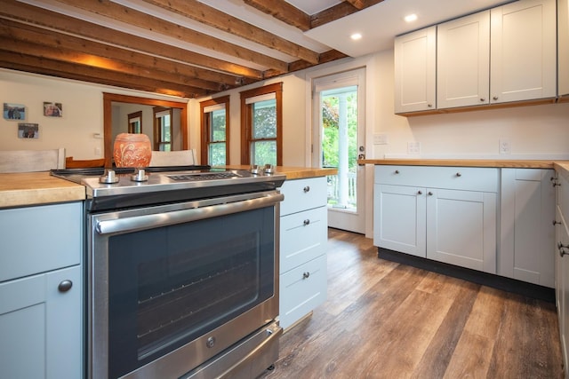 kitchen with light wood-style flooring, stainless steel electric stove, beamed ceiling, and butcher block counters