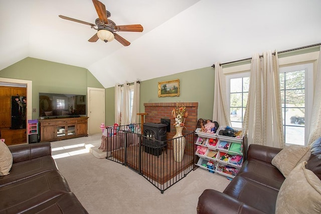 carpeted living room featuring lofted ceiling and ceiling fan