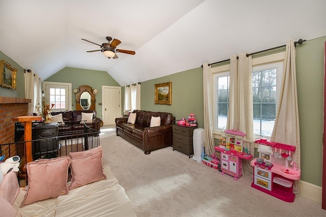 carpeted living area featuring a ceiling fan and lofted ceiling