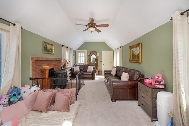 living room with light carpet, ceiling fan, and vaulted ceiling