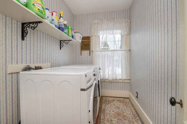 laundry room featuring laundry area, washer and clothes dryer, and wallpapered walls