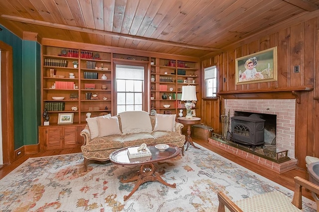 living area featuring wooden ceiling, plenty of natural light, and wood finished floors