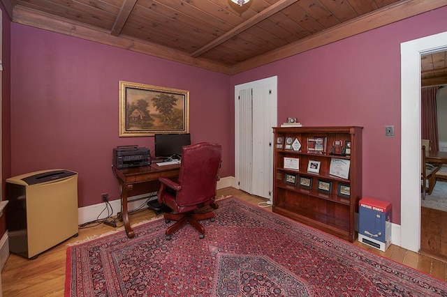 office area with baseboard heating, wooden ceiling, baseboards, and wood finished floors