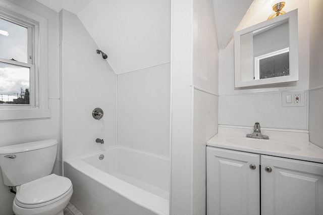 bathroom with lofted ceiling, bathtub / shower combination, toilet, and vanity