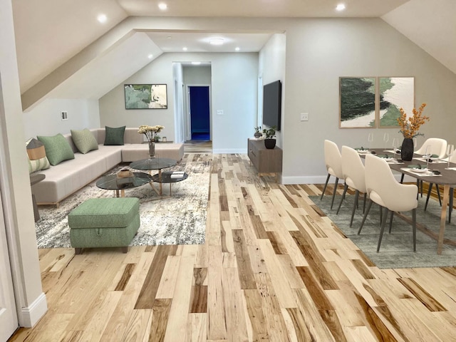 living area featuring baseboards, vaulted ceiling, wood finished floors, and recessed lighting