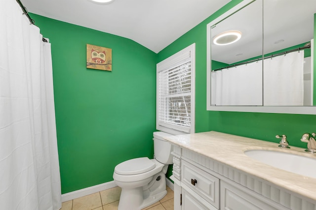 bathroom featuring baseboards, vanity, toilet, and tile patterned floors