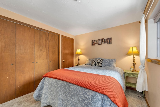 carpeted bedroom featuring two closets