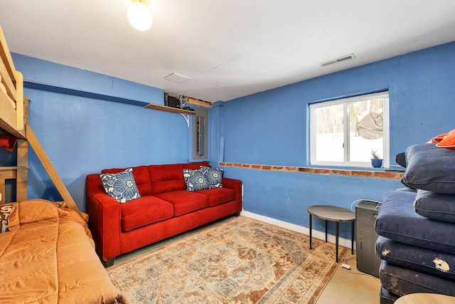 living room featuring baseboards and visible vents