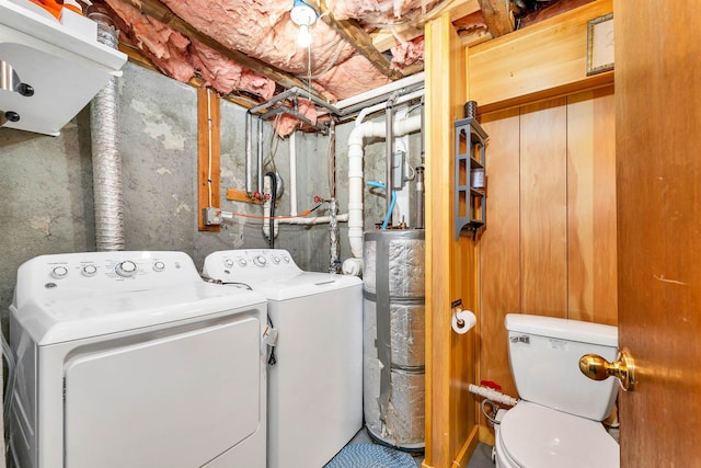 laundry room with washing machine and dryer, laundry area, and water heater