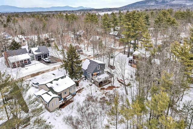 snowy aerial view with a mountain view