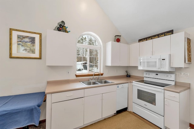 kitchen featuring light countertops, white appliances, a sink, and white cabinetry