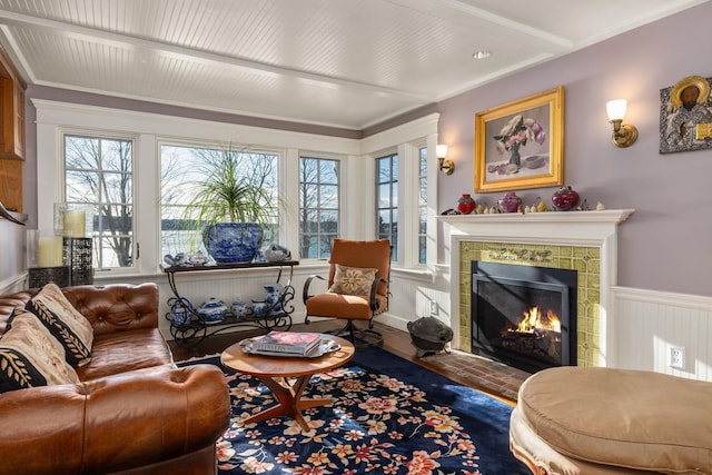 interior space with ornamental molding and a fireplace