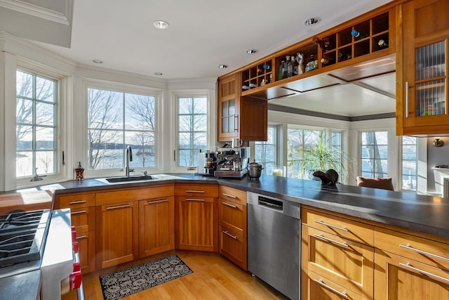 kitchen with a sink, light wood-style floors, stainless steel dishwasher, brown cabinetry, and crown molding