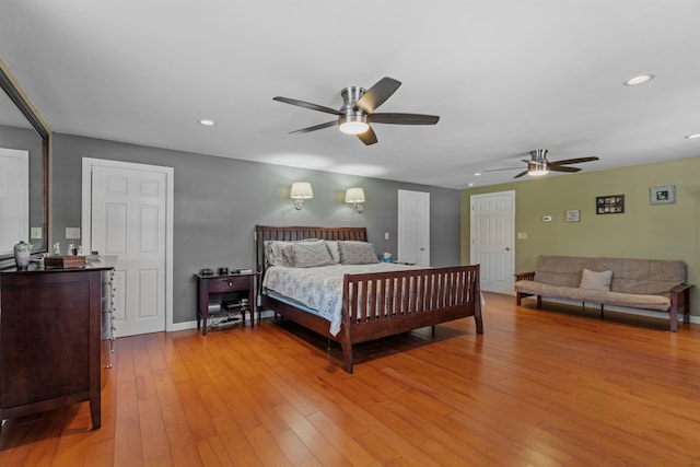 bedroom featuring recessed lighting, light wood-style flooring, and baseboards