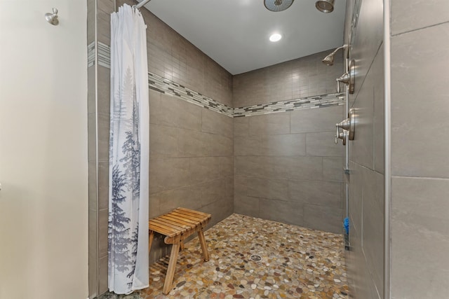 full bath featuring a tile shower