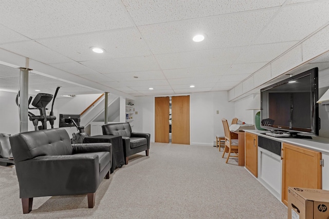 living room with recessed lighting, light carpet, and a paneled ceiling