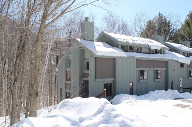 view of front of home featuring a chimney