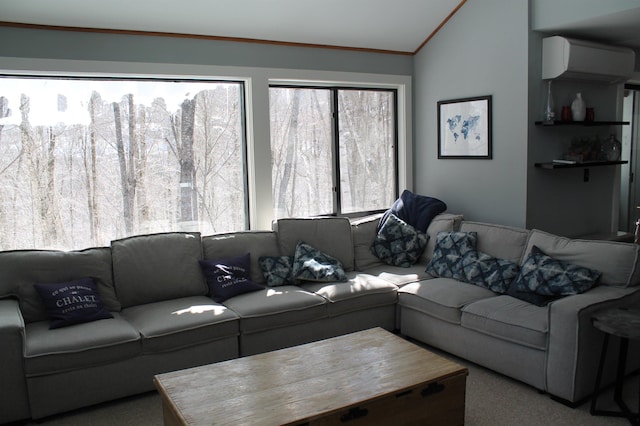 carpeted living area featuring lofted ceiling, crown molding, and a wall mounted AC