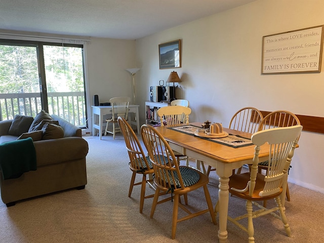 view of carpeted dining area