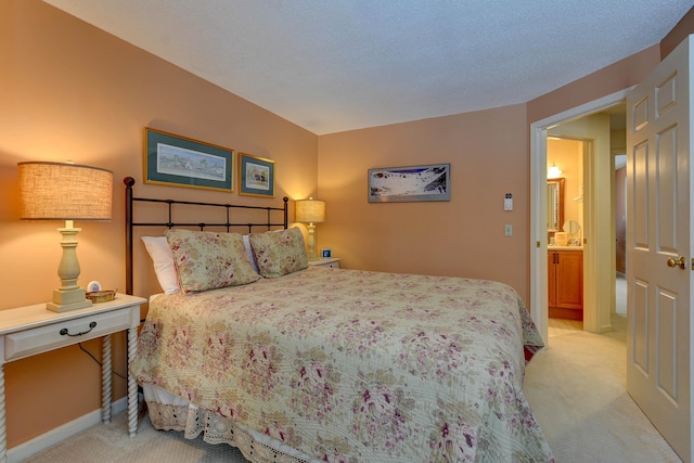 bedroom with light carpet and baseboards