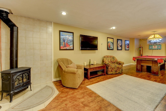 recreation room featuring a wood stove, pool table, baseboards, and recessed lighting