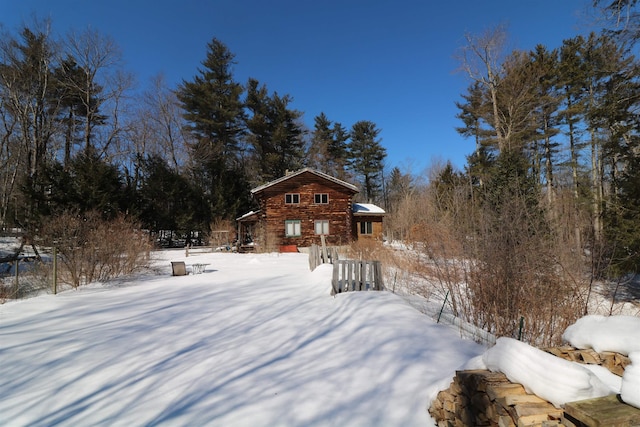 view of yard layered in snow