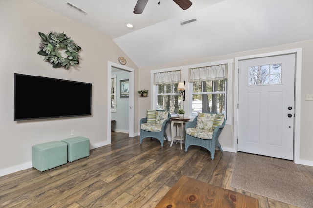 entrance foyer featuring lofted ceiling, wood-type flooring, visible vents, and baseboards