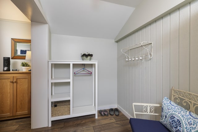 mudroom featuring dark wood-style floors, baseboards, and vaulted ceiling