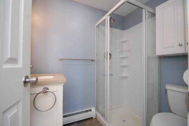 full bath with a baseboard radiator, a shower stall, and toilet