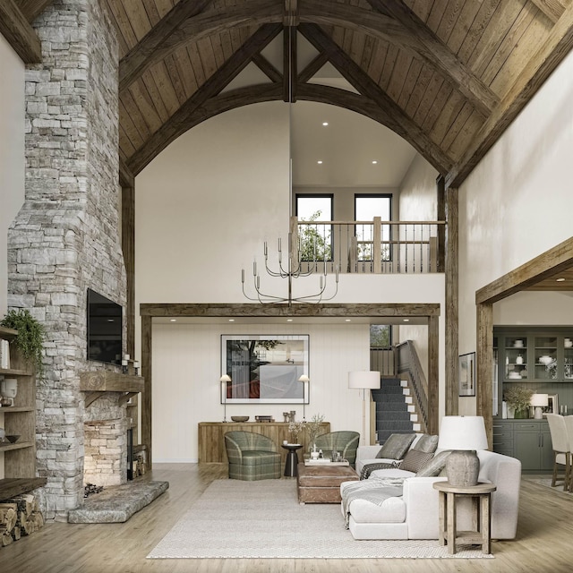 living area featuring high vaulted ceiling, wood ceiling, a stone fireplace, and wood finished floors