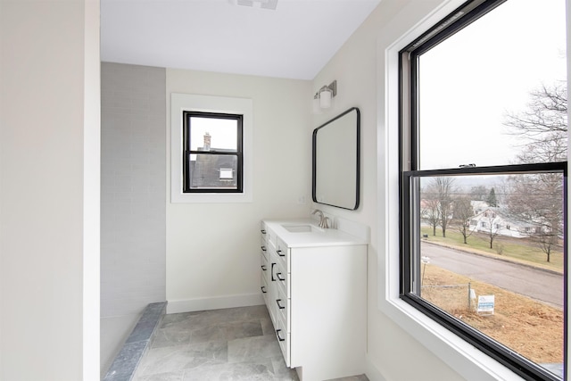 bathroom featuring vanity and baseboards