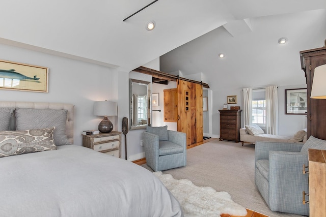 bedroom with recessed lighting, light colored carpet, a barn door, vaulted ceiling, and baseboards