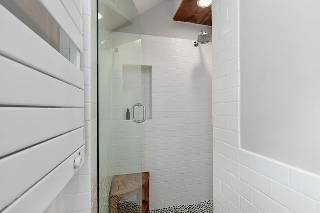 bathroom featuring a shower stall