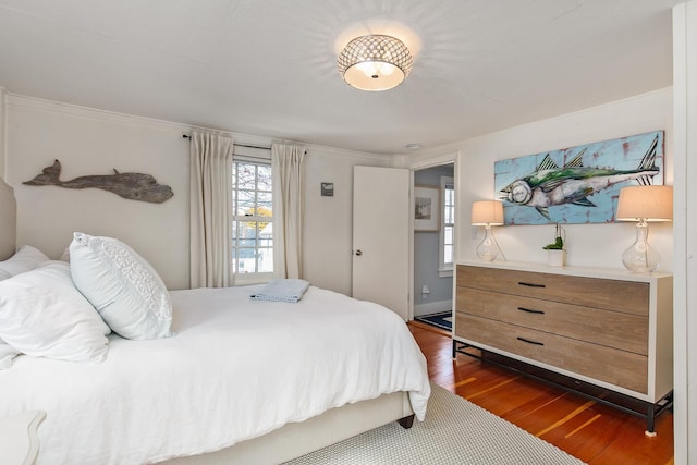 bedroom with dark wood-style floors