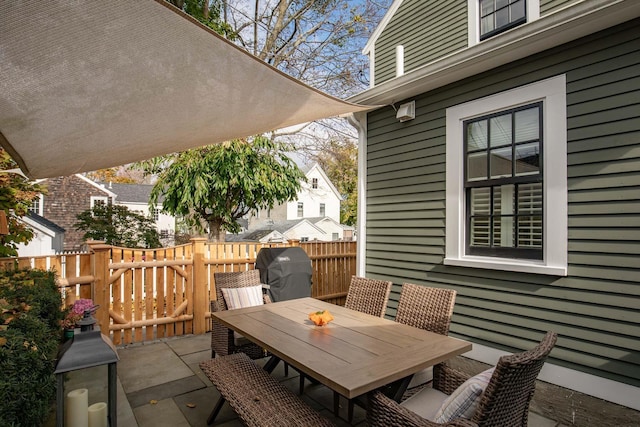 view of patio / terrace with outdoor dining area and fence