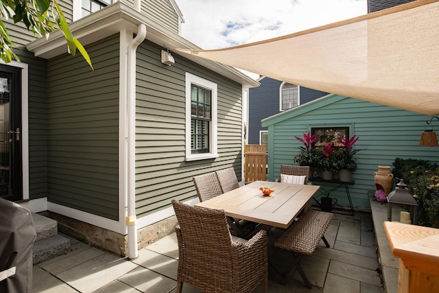 view of patio featuring outdoor dining area