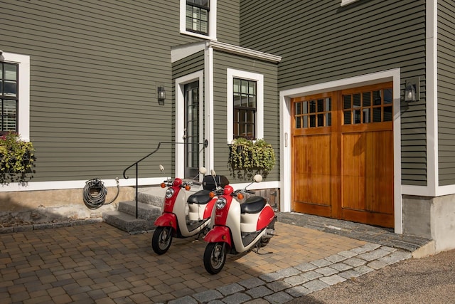 property entrance with an attached garage