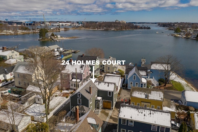 drone / aerial view with a water view and a residential view