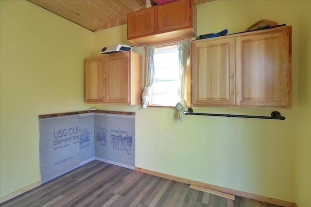 kitchen featuring vaulted ceiling, wood finished floors, wood ceiling, and baseboards